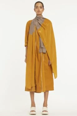 Three Mustard Yellow Panelled Kurta Set With A Dupatta